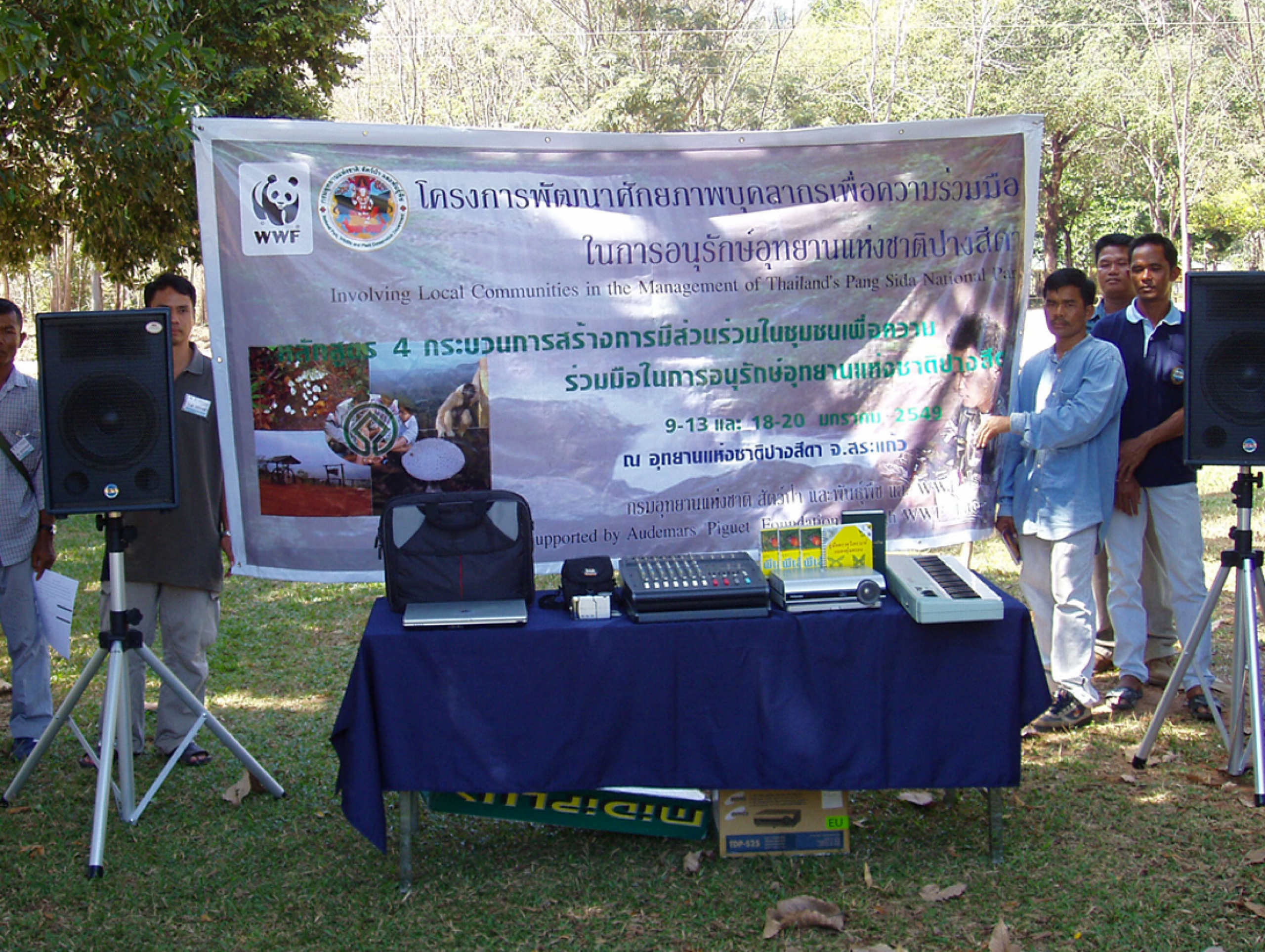 Men presenting a project outside in Thailand