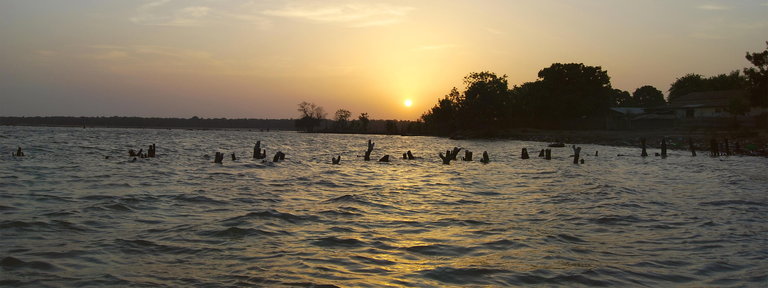 A sunset by the water