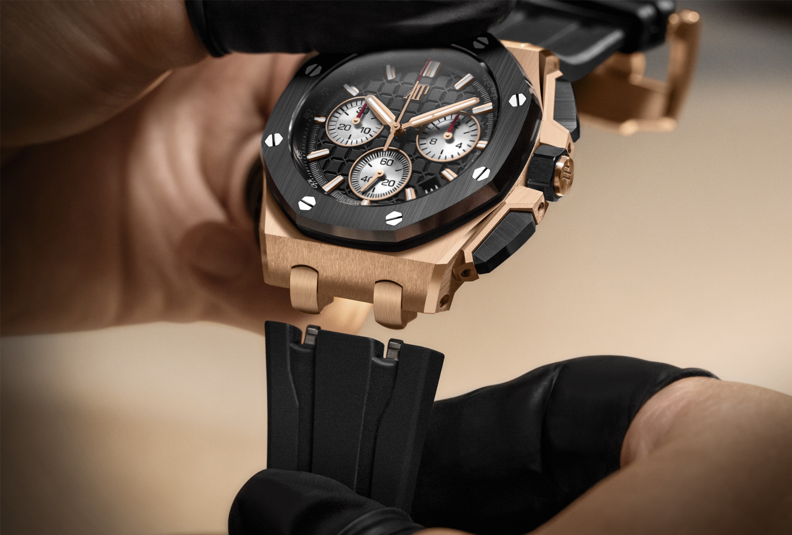 A man replaces the strap of a Royal Oak Offshore Selfwinding Chronograph watch.