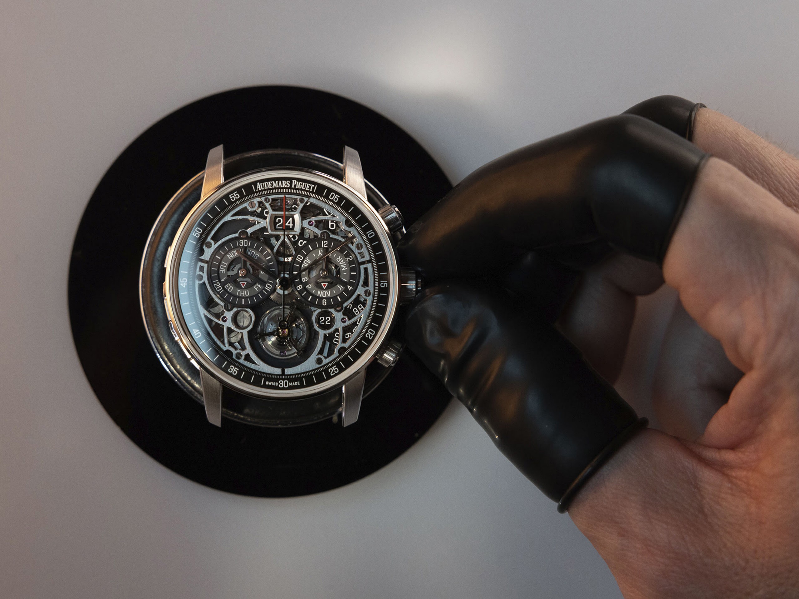 An expert presenting watches with chiming complications