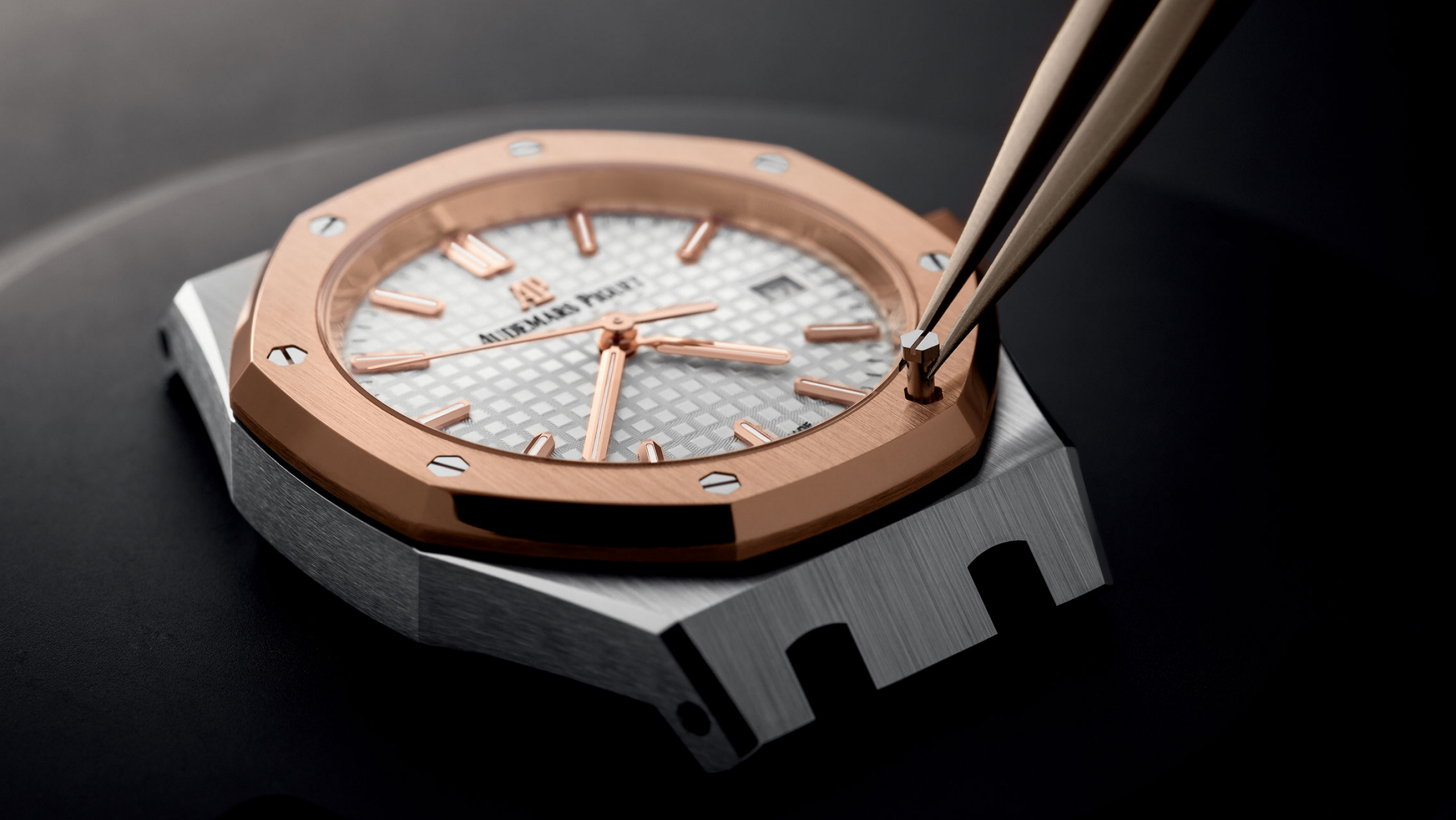 A watch being assembled by a watchmaker.