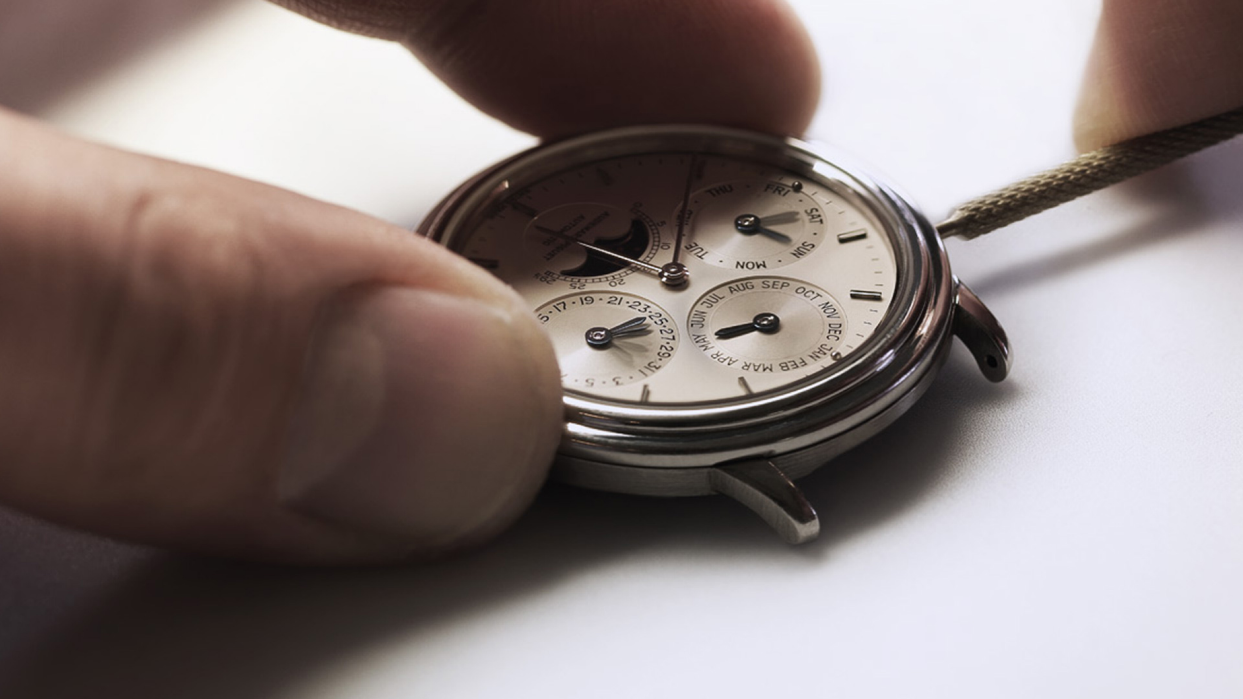 A watch being assembled by a watchmaker.