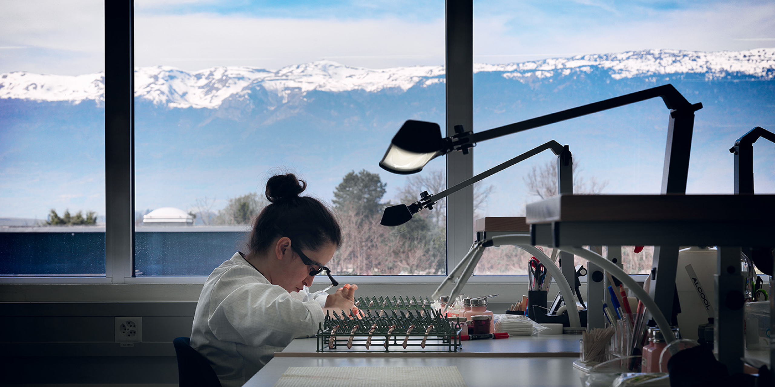 A watchmaker working on a workshop.