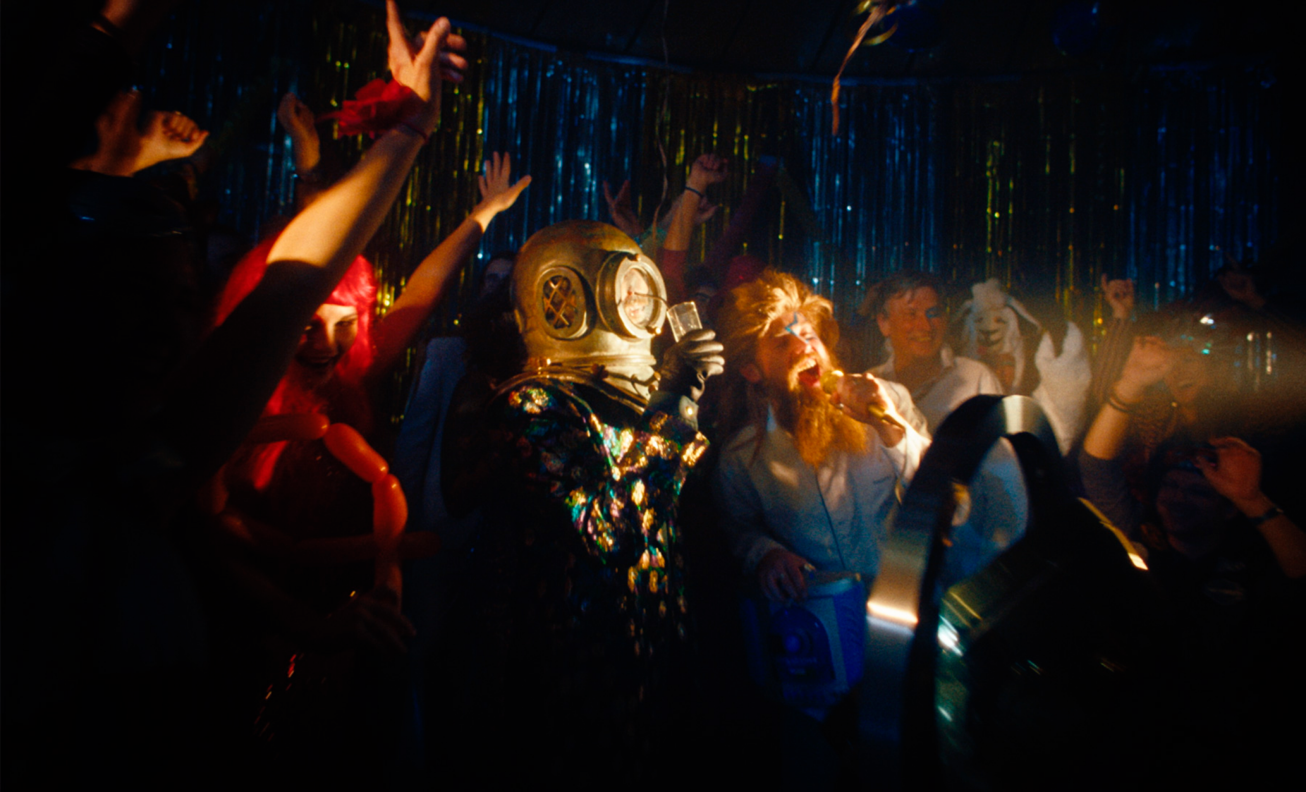 A group of people celebrating with a diver.